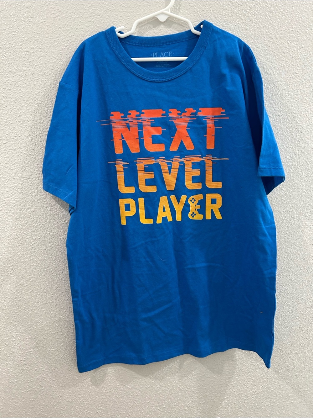 The Children's Place Blue Tee with Orange & Yellow "Next Level Player" Graphic
